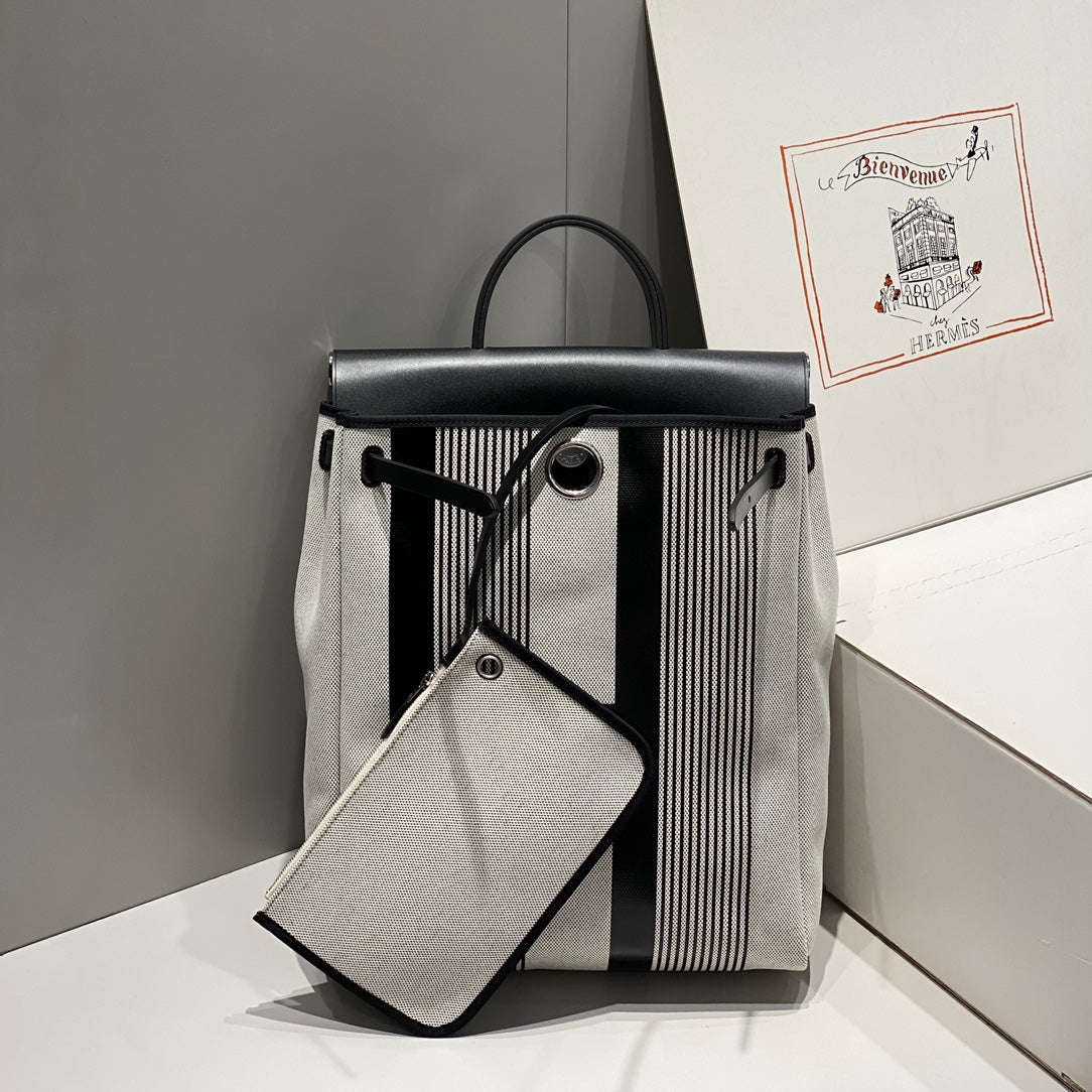 HERBAG A DOS ZIP RETOURNE BACKPACK 29 IN OFF-WHITE MIX BLACK CANVAS AND CALFSKIN