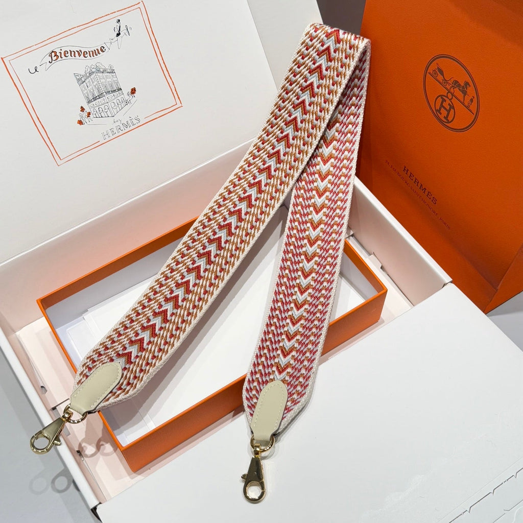 25S HERMES BAG STRAP ORANGE AND RED PATTERN 85 IN CANVAS GOLD HARDWARE