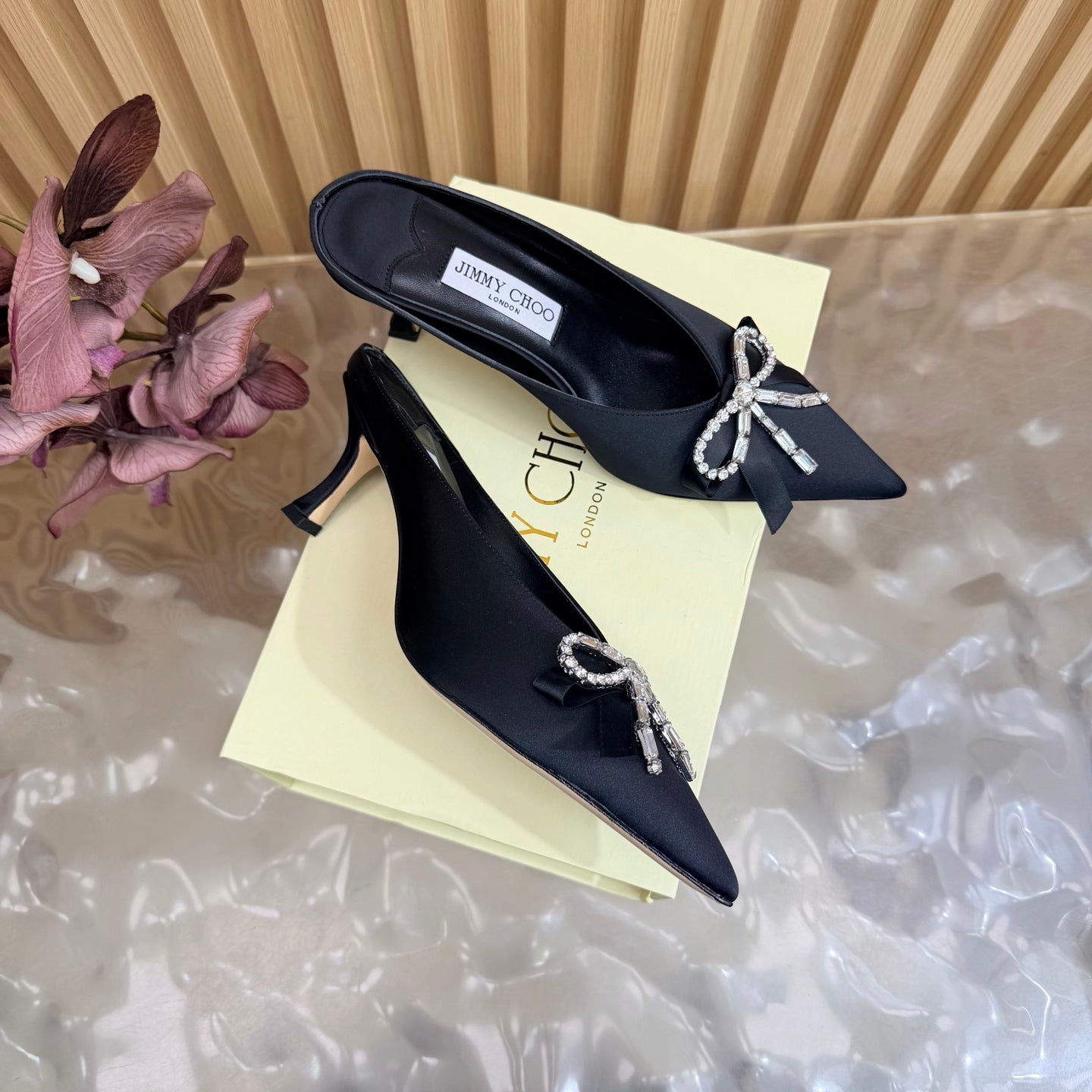 JIMMY CHOO 26S HIGH-HEELED MULES 65 MM IN BLACK SATIN WITH RHINESTONE BOW