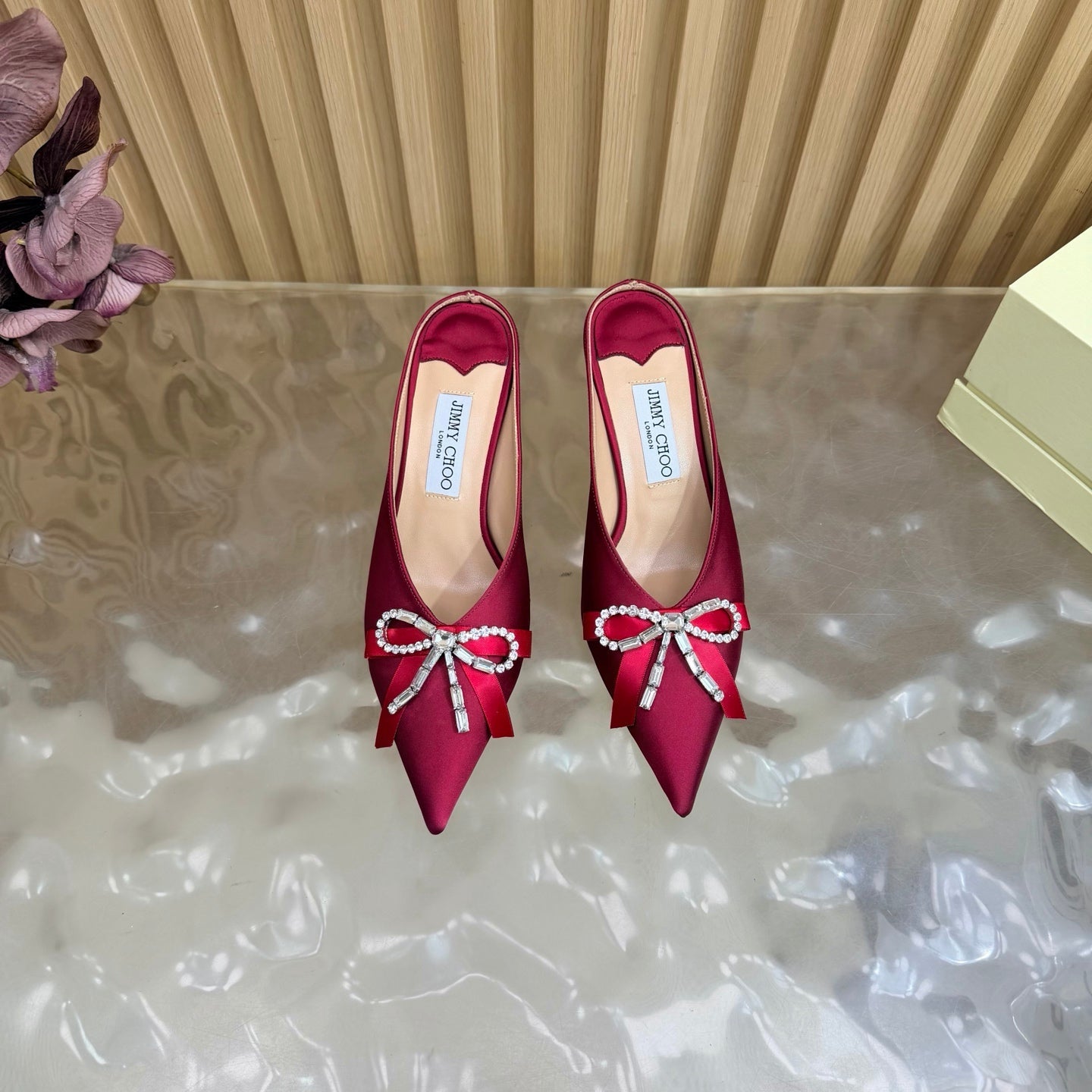 JIMMY CHOO 26S HIGH-HEELED MULES 65 MM IN RED SATIN WITH RHINESTONE BOW