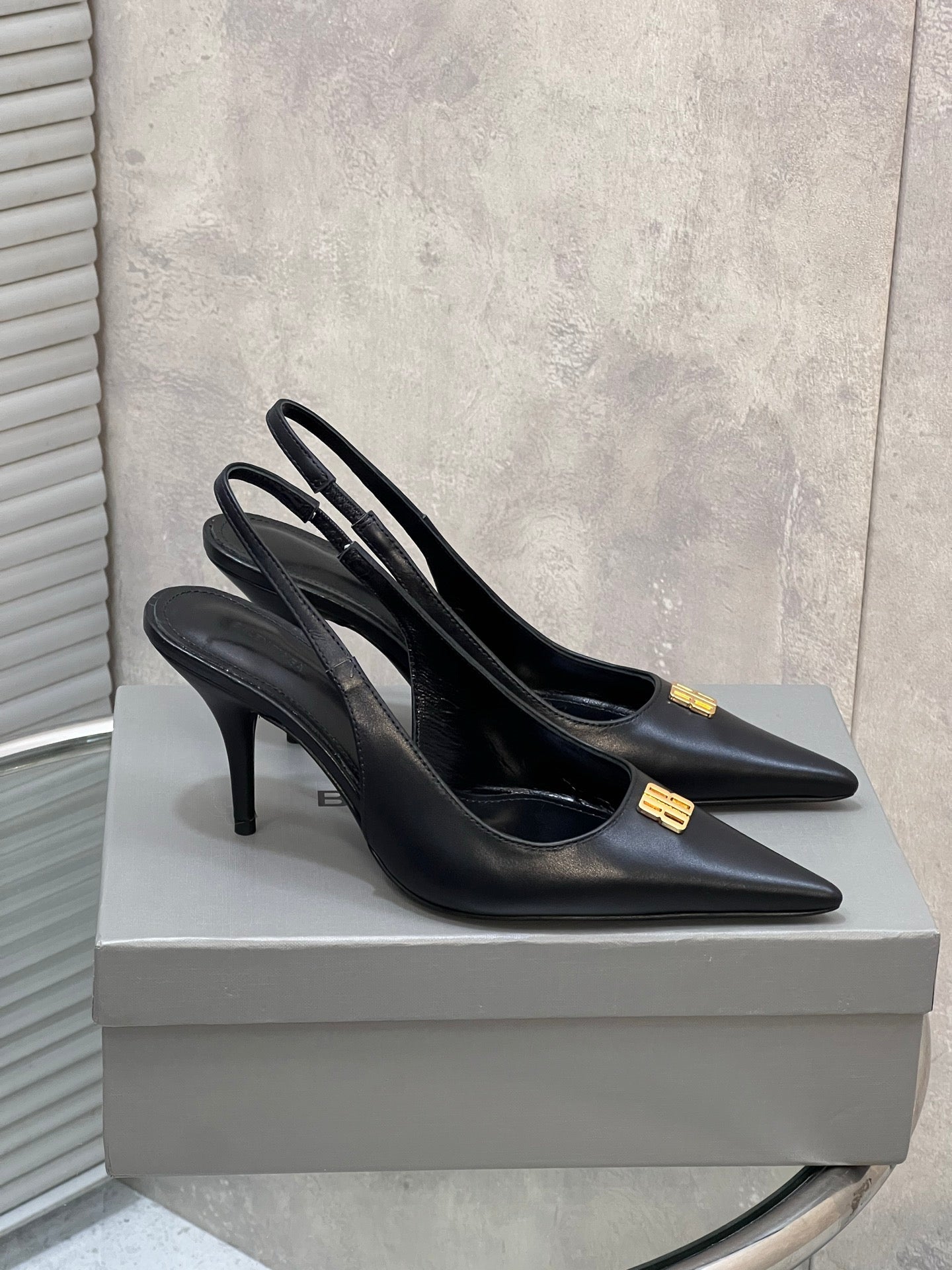 BALENCIAGA 25S HIGH-HEEL SLINGBACK 85 MM IN BLACK COW LEATHER WITH GOLD HARDWARE