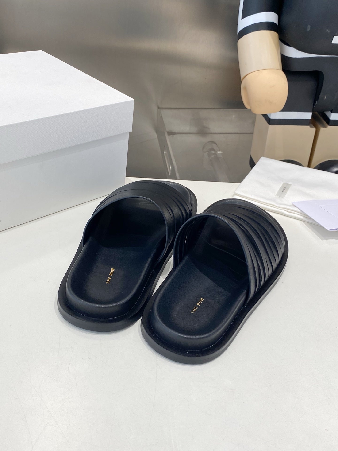 THE ROW 26S MULTI STRAP SLIDES IN BLACK CALFSKIN