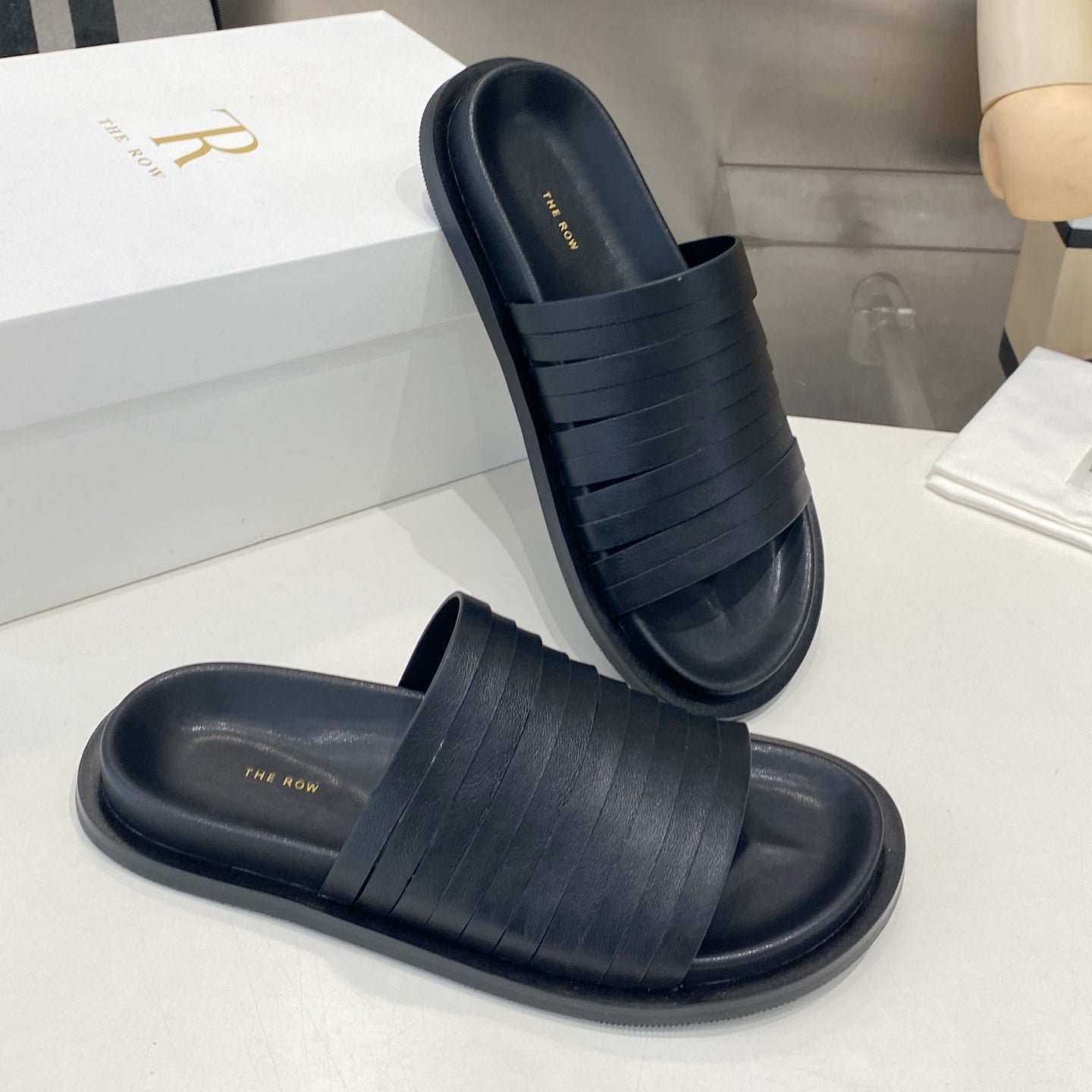 THE ROW 26S MULTI STRAP SLIDES IN BLACK CALFSKIN