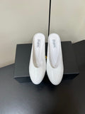 ALAIA WEDGE MULES 25S IN CREAM WHITE LAMBSKIN