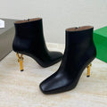 KNOT ANKLE BOOT IN BLACK CALFSKIN WITH GOLD METAL HEEL 9 CM