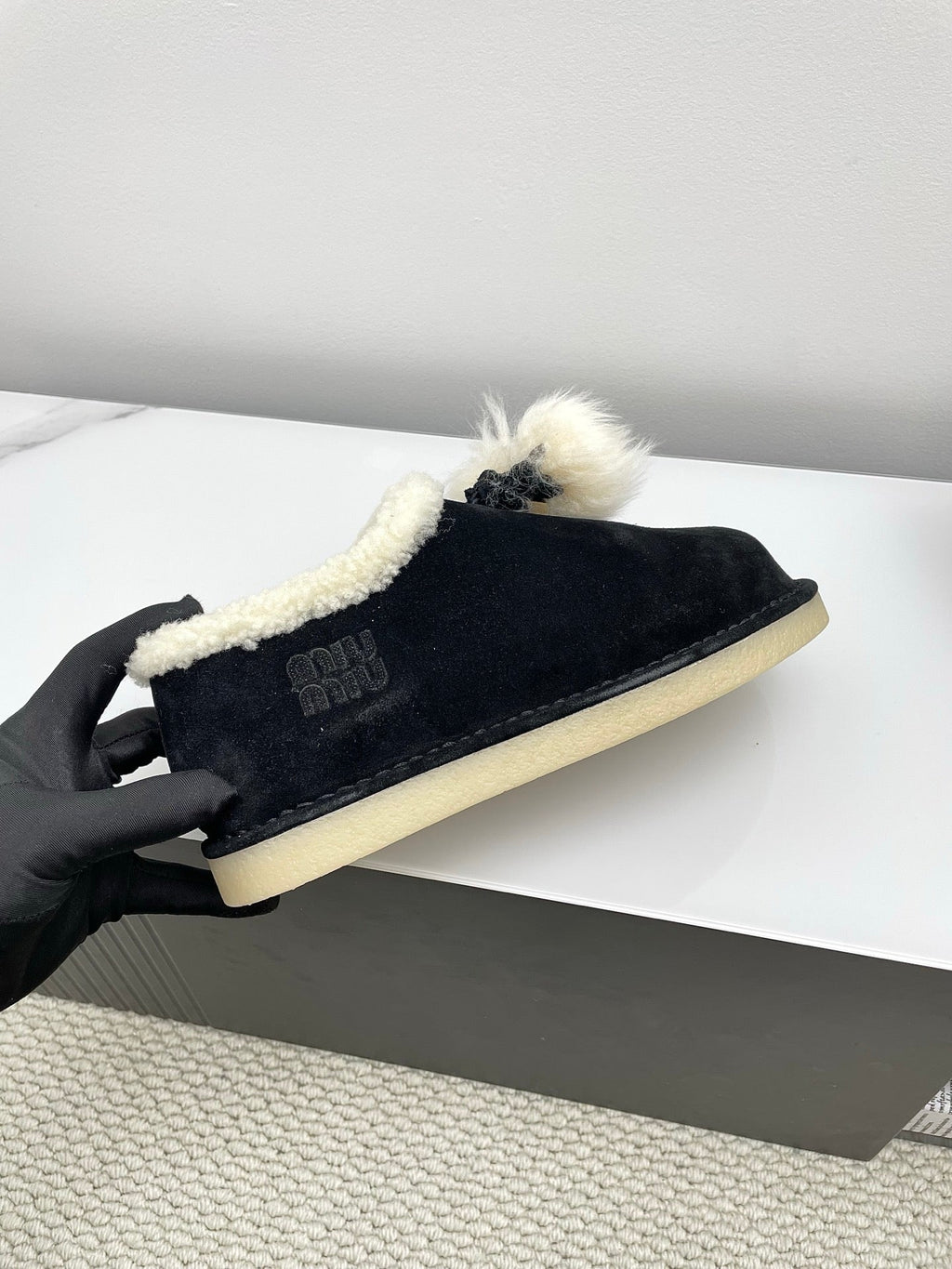 MIUMIU 26S ANKLE SHEARLING BOOTS IN BLACK SUEDE
