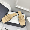 CHANEL CC LOGO MULES IN BEIGE CALFSKIN