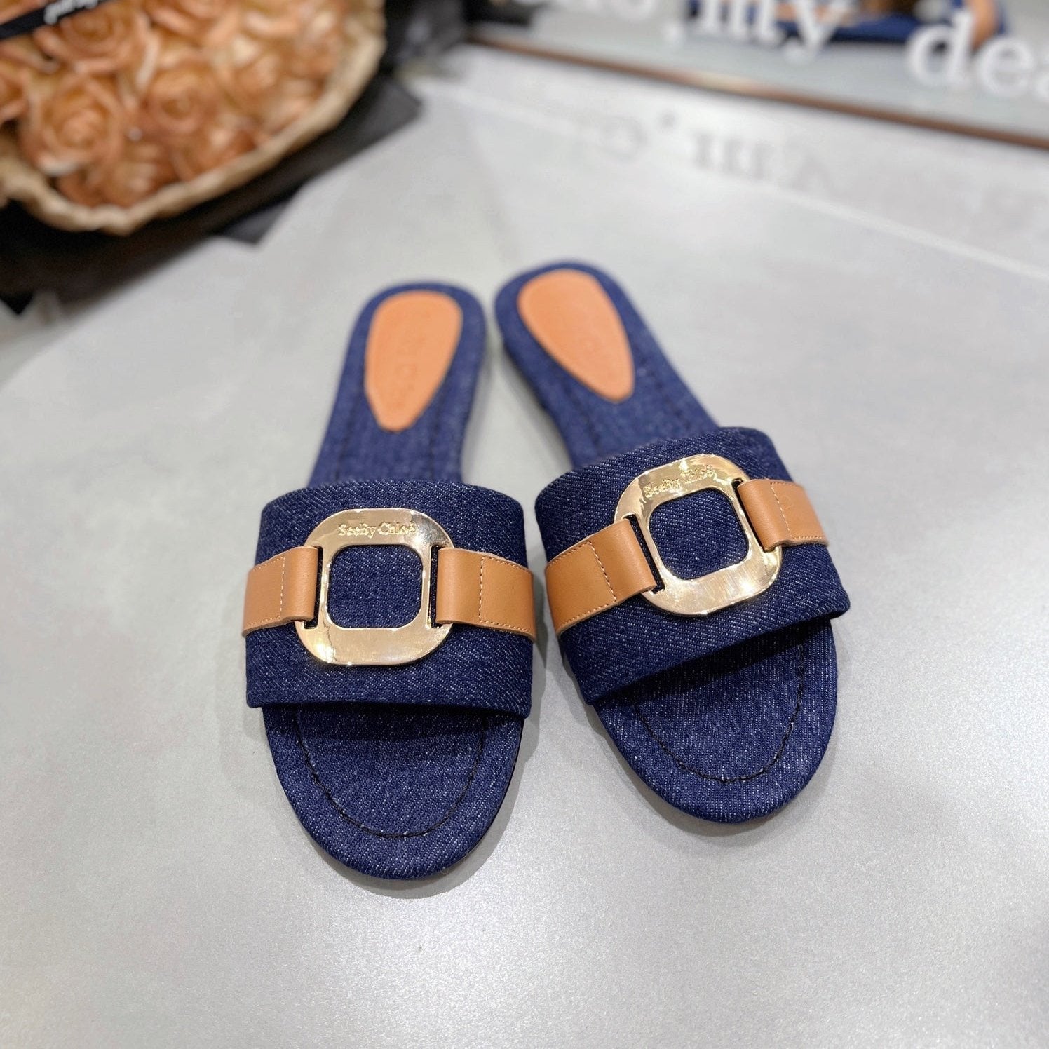SLIDE MULE IN NAVY BLUE DENIM AND BROWN CALFSKIN GOLD HARDWARE