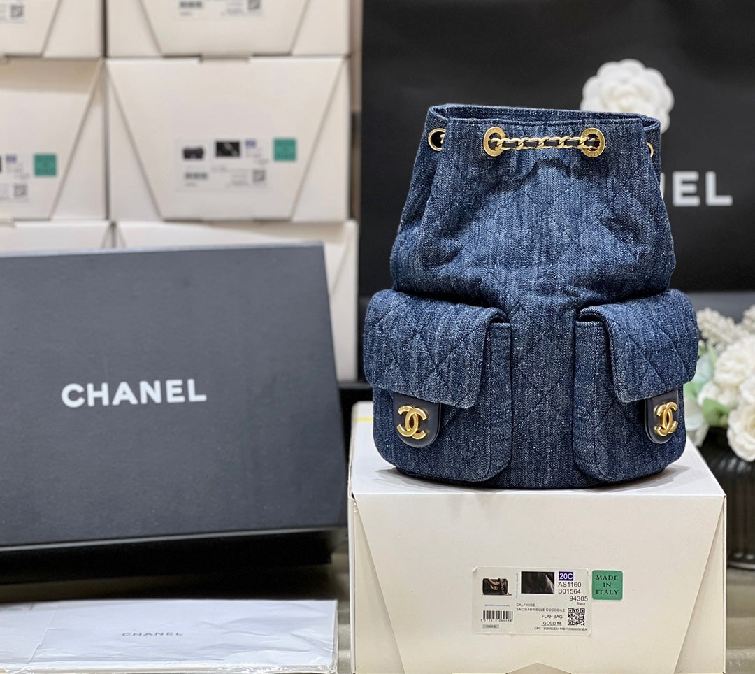 DRAWSTRING BUCKET BACKPACK 24 IN DARK BLUE DENIM GOLD HARDWARE