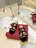VALENTINO 26S ROCKSTUD CAGED SANDALS IN BLACK PATENT CALFSKIN